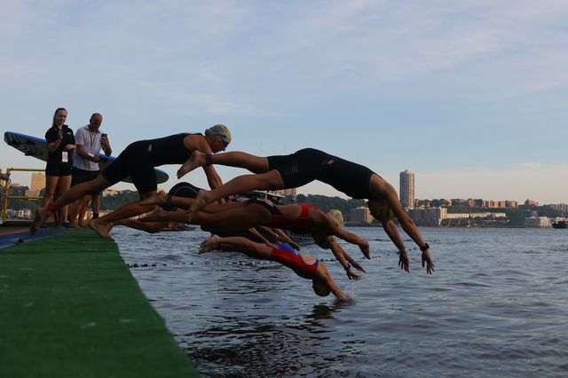 Athletes participate in the swimming portion of the New York City Triathlon.
